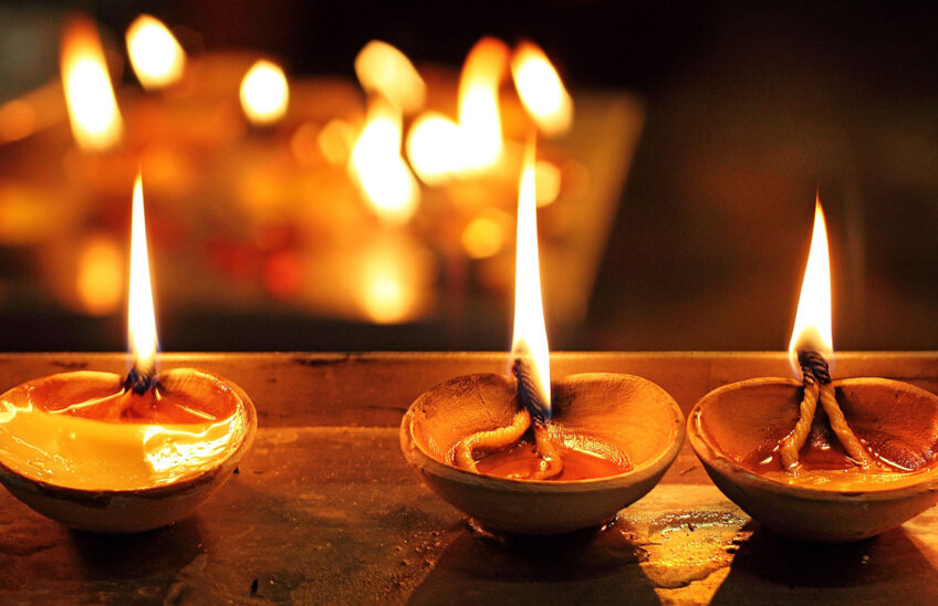 Lit ghee lamps (diyas)