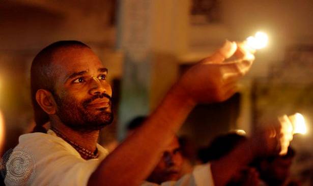 Devotees offering ghee lamps during the month of Kartik