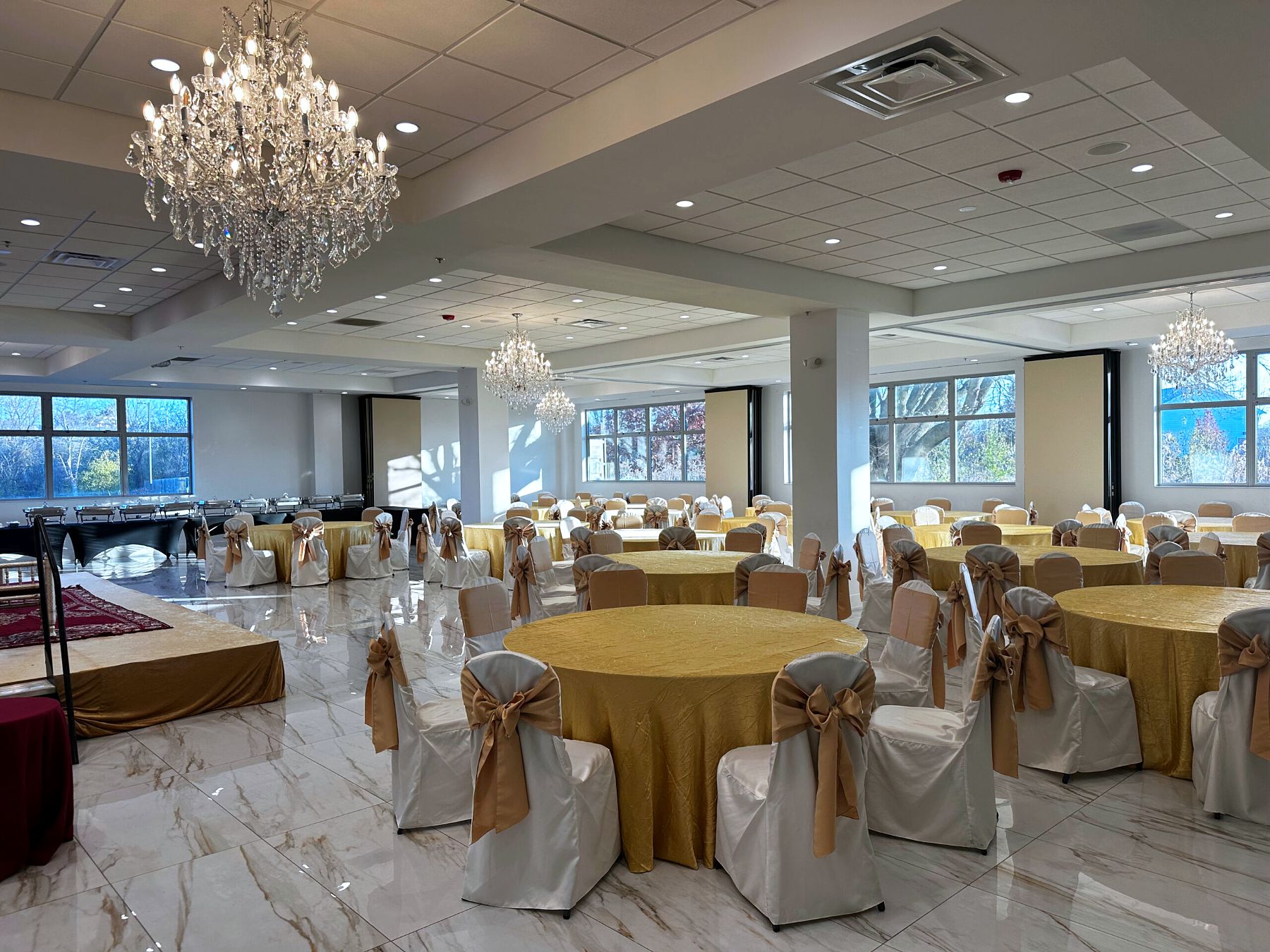 Barsana Banquet Hall at ISKCON Naperville set with round tables for a reception
